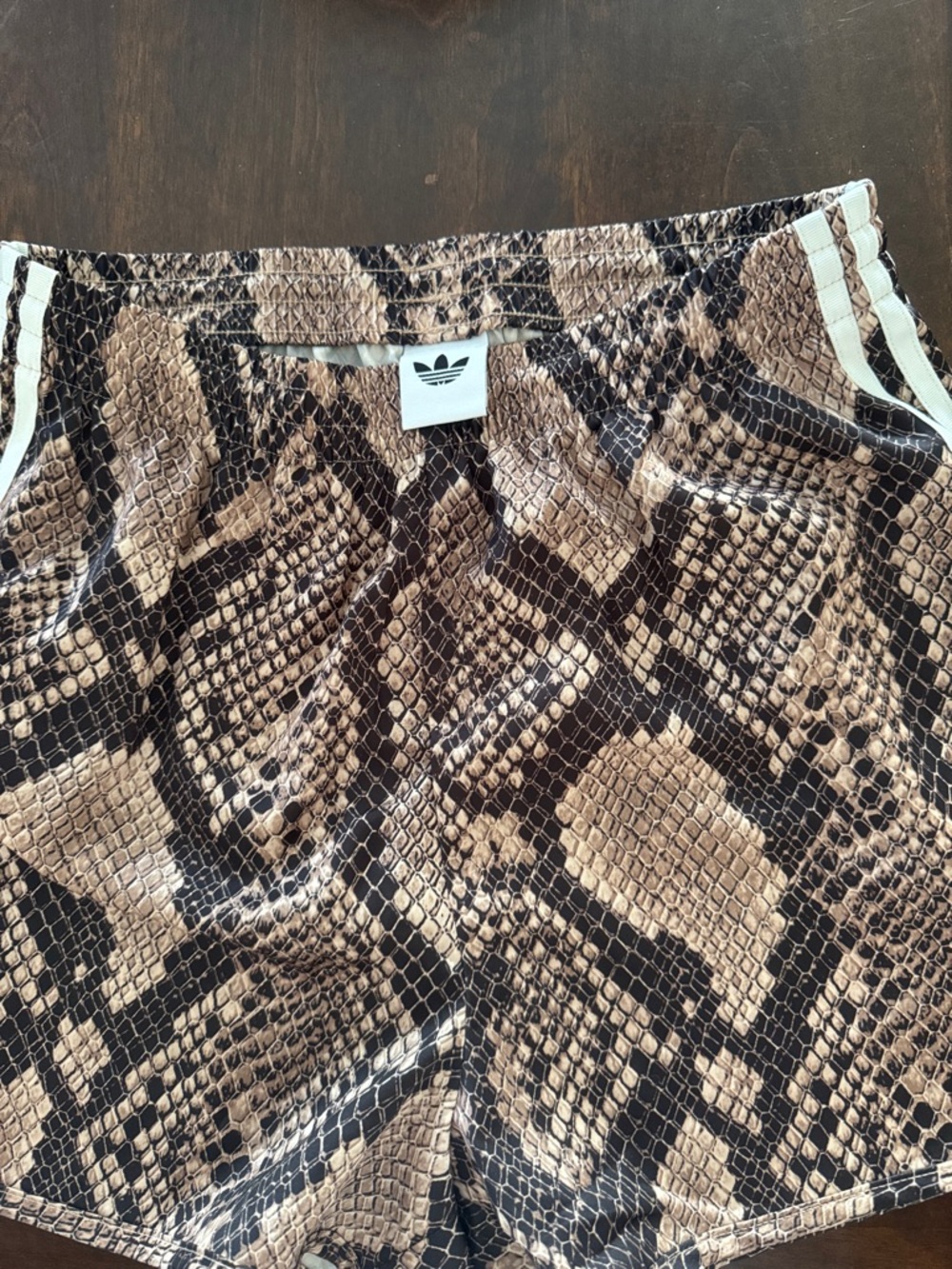 adidas Women's Brown Snake-Print Athletic Shorts with White Stripes
Size Small